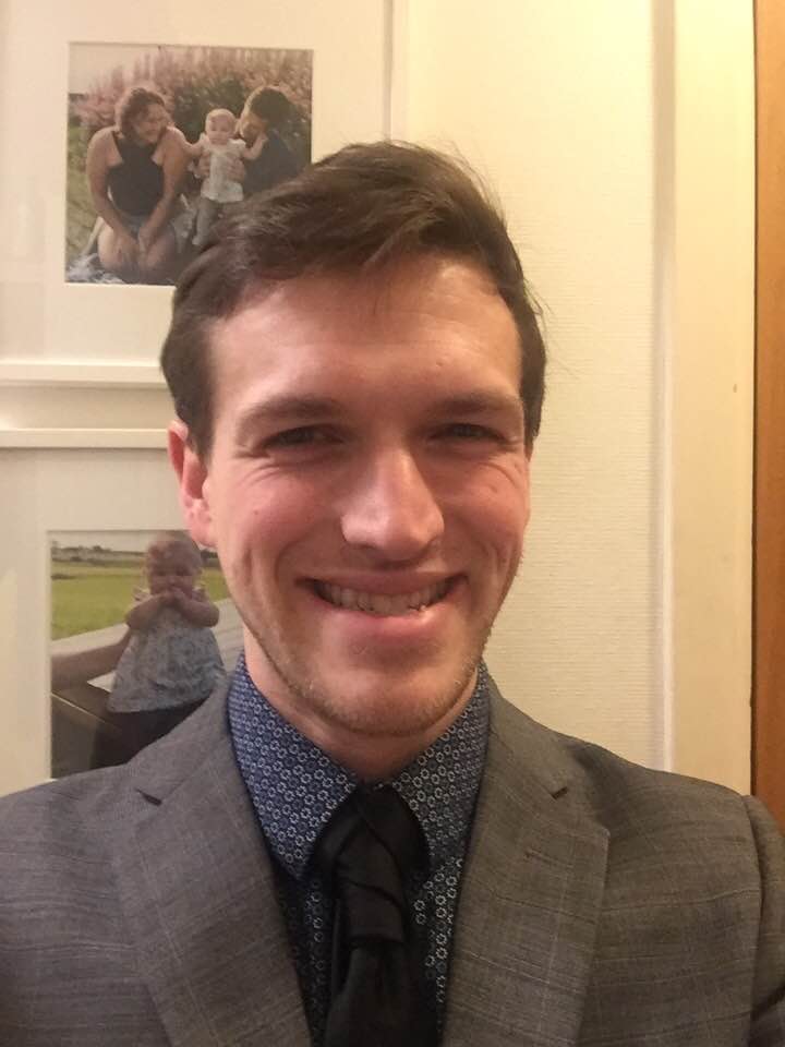 a picture of Justin Lee Attinoto smiling